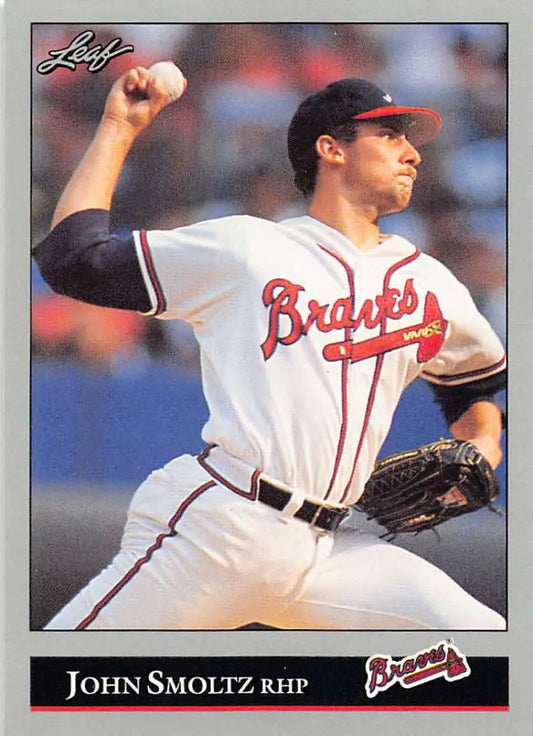 Baseball player John Smoltz in Atlanta Braves uniform pitching on a baseball card