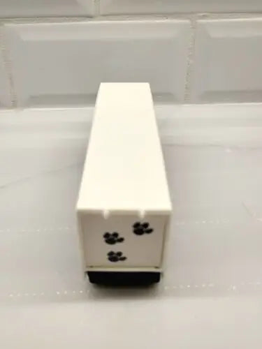 White rectangular box with paw prints for Penn State Nittany Lions tractor trailer team collect