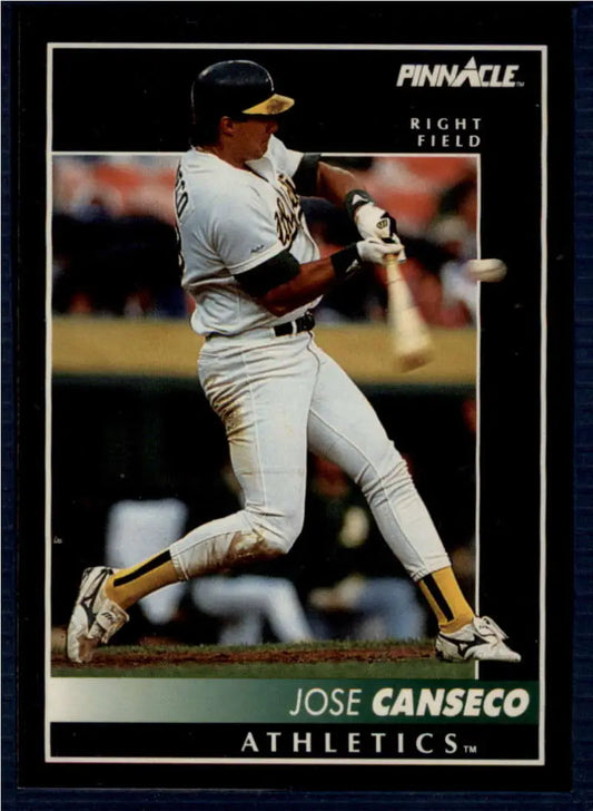 Jose Canseco mid-swing in white uniform on 1992 Pinnacle Oakland Athletics baseball card