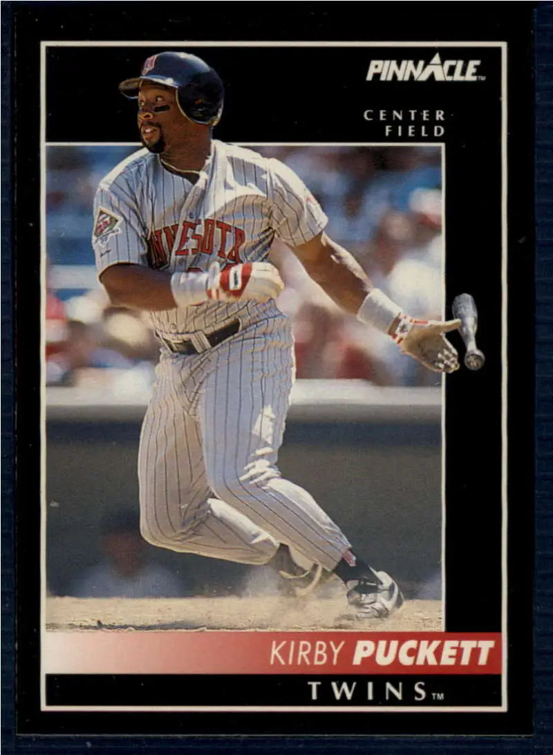 Baseball card of Kirby Puckett swinging, Minnesota Twins pinstriped uniform