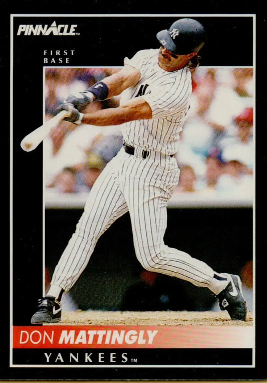 Baseball card of Don Mattingly swinging in New York Yankees pinstriped uniform