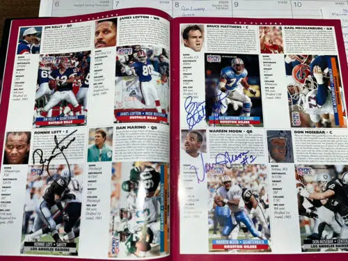Autographed NFL player profiles including Emmitt Smith, Barry Sanders in Pro Bowl program