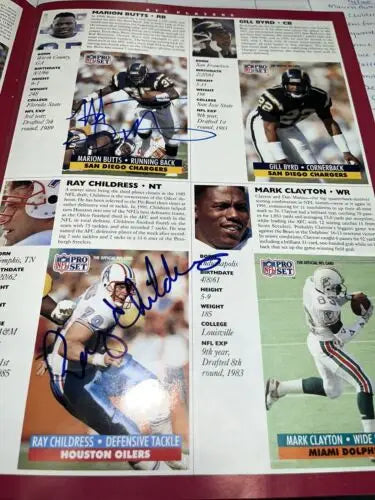 Signed football player cards featuring Emmitt Smith, Barry Sanders, and Pro Bowl legends