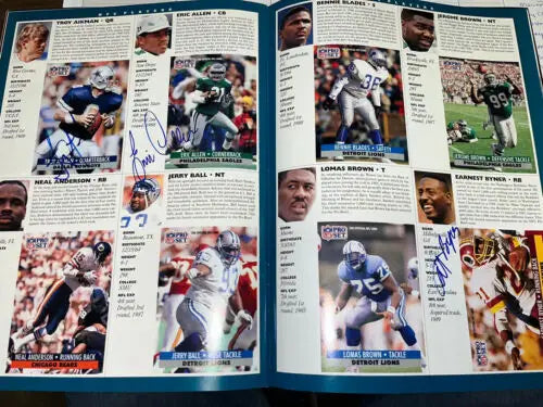 Autographed NFL player profiles featuring Emmitt Smith and Barry Sanders from Pro Bowl program