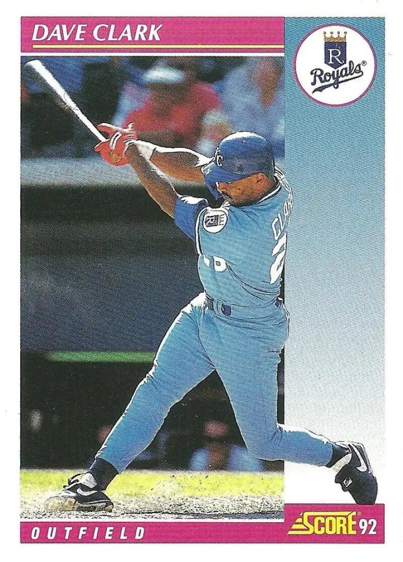 Baseball card of Dave Clark swinging in Kansas City Royals powder blue uniform