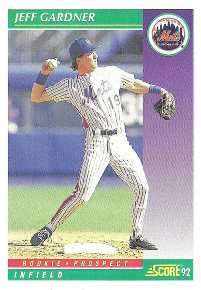 Baseball player Jeff Gardner in New York Mets pinstripe uniform throwing ball