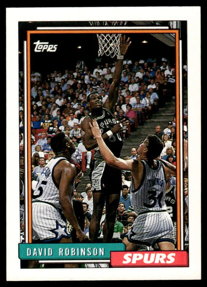 Vintage Topps basketball card of David Robinson shooting against Orlando Magic defenders