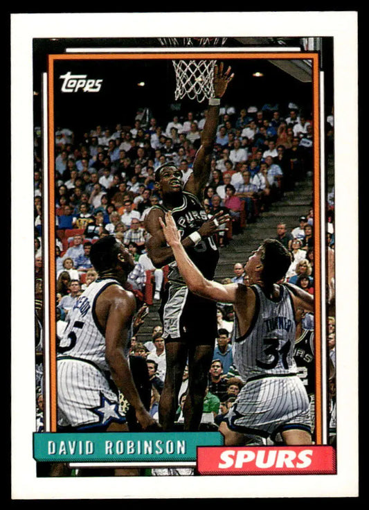 Vintage Topps basketball card of David Robinson shooting against Orlando Magic defenders