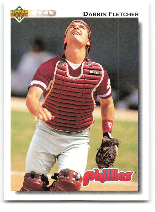 Baseball catcher in red striped chest protector from 1992 Upper Deck Darrin Fletcher card