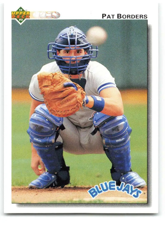 Baseball catcher Pat Borders in Toronto Blue Jays uniform, ready to play
