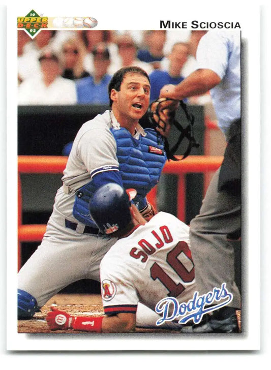 Baseball action at home plate featuring Mike Scioscia from Upper Deck baseball card