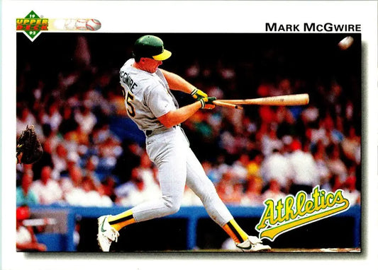 Baseball player in white Oakland Athletics uniform swinging bat for Mark McGwire card