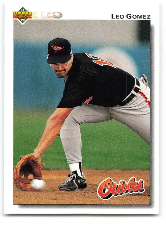 Baseball player Leo Gomez fielding a ground ball in Baltimore Orioles uniform