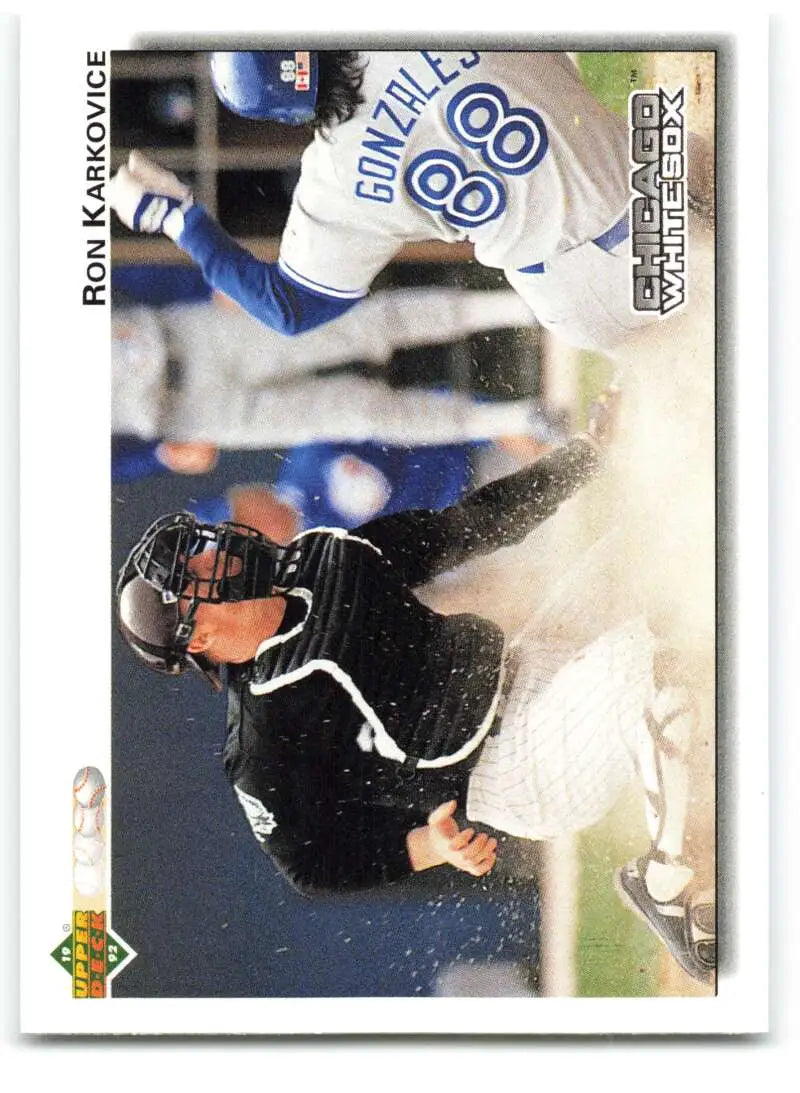 Baseball player in black uniform sliding into base, showcasing Ron Karkovice of Chicago White Sox