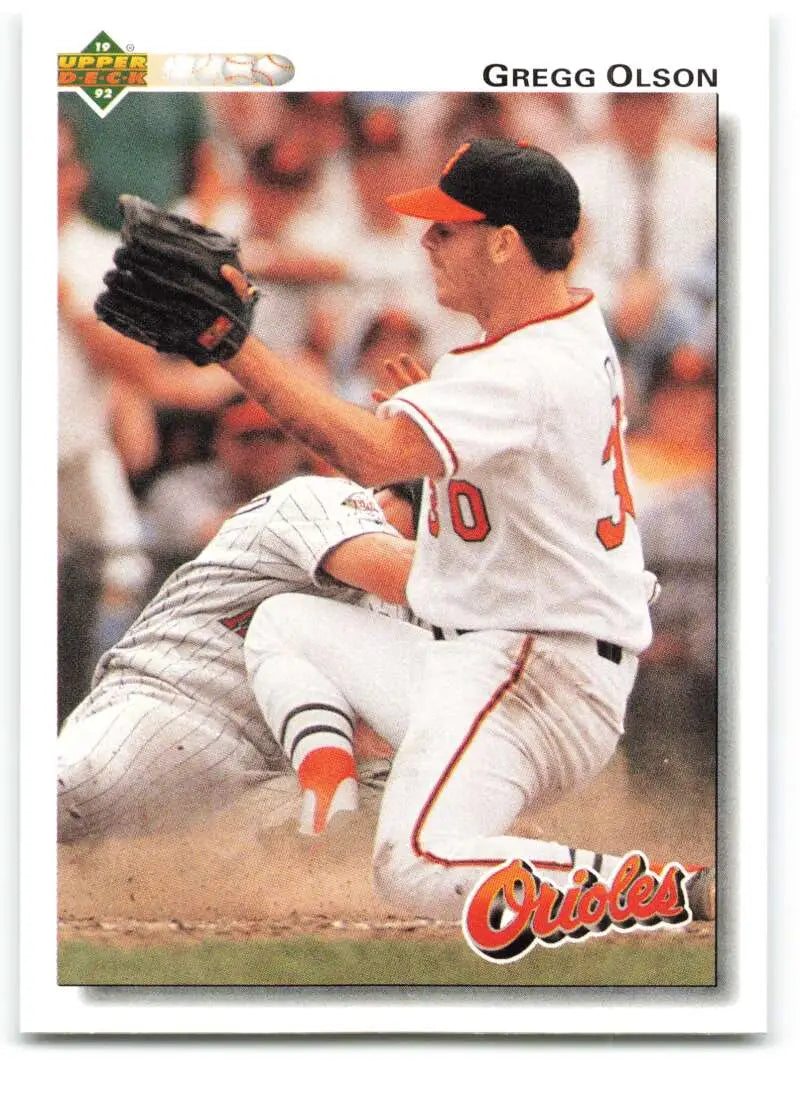 Gregg Olson mid-pitching in Baltimore Orioles uniform on 1992 Upper Deck baseball card