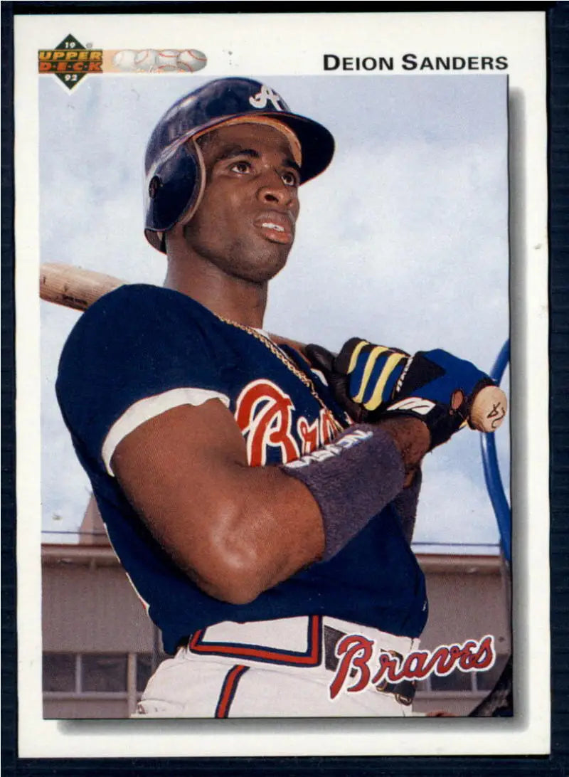 Atlanta Braves Baseball Card of Deion Sanders in batting stance wearing navy uniform