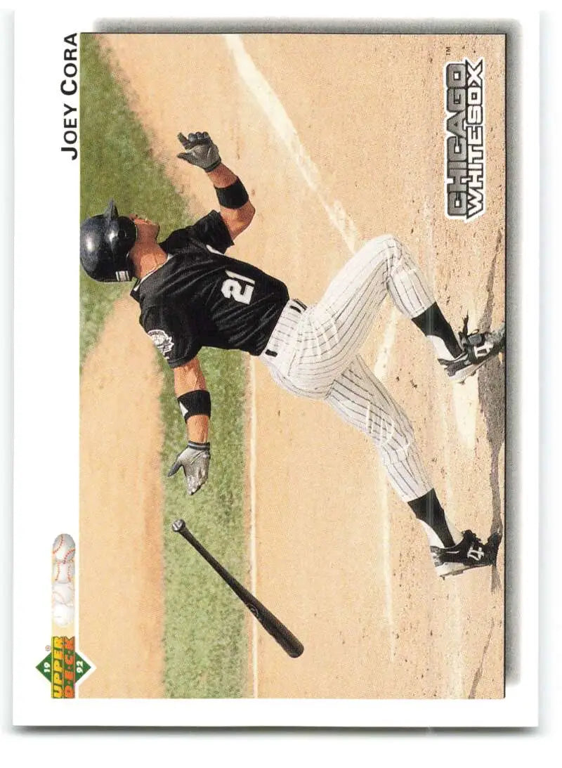 Baseball player sliding into home plate in Chicago White Sox uniform on baseball card