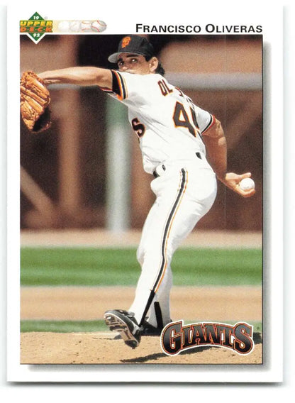 Baseball player Francisco Oliveras mid-pitch in San Francisco Giants uniform