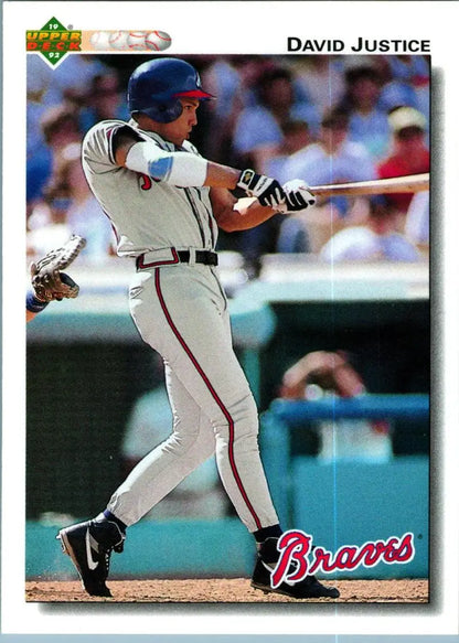 David Justice swinging bat in Atlanta Braves uniform on baseball card