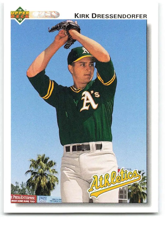 Baseball card of Kirk Dressendorfer in wind-up pose for Oakland Athletics jersey