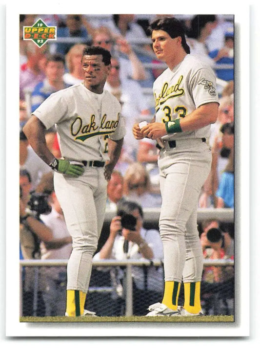 Two Oakland Athletics players Rickey Henderson and Jose Canseco in white uniforms
