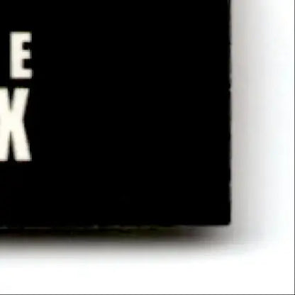 Black rectangular box with white e x text from 1993-94 Upper Deck Hockey Claude Lemieux card