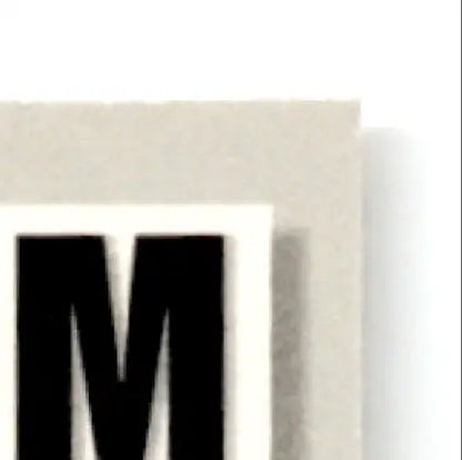 Black M letter sticker from 1993-94 Upper Deck Hockey Luc Robitaille card