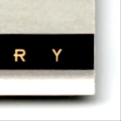 Black rectangular sticker with gold letters r y on white surface for 1993-94 Upper Deck Hockey Theoren Fleury rookie card