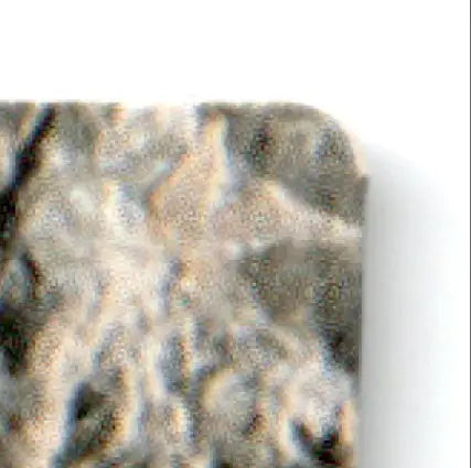 Rough textured grey and brown surface of 1993 Action Packed Football Los Angeles Raiders Howie Long #19