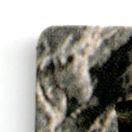 Close-up of gray black granite countertop corner with rounded edge for action packed football product