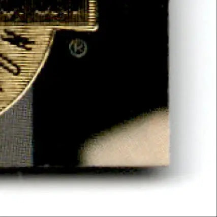 Gold electric guitar with black pickguard and white logo from the 1993 Classic Hockey Draft Jason Arnott #7