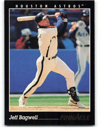 Baseball card of Jeff Bagwell swinging in a white uniform for the Houston Astros
