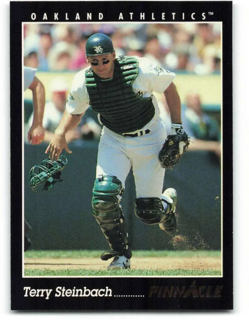 Terry Steinbach in full gear running on the field for Oakland Athletics baseball card