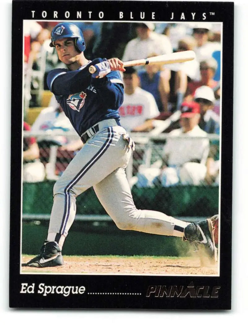 Baseball card of Ed Sprague mid-swing for the Toronto Blue Jays team