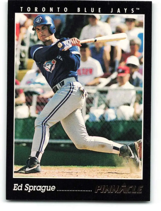 Baseball card of Ed Sprague mid-swing for the Toronto Blue Jays team