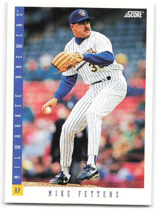 Baseball card of Mike Fetters pitching for the Milwaukee Brewers in a pinstriped uniform
