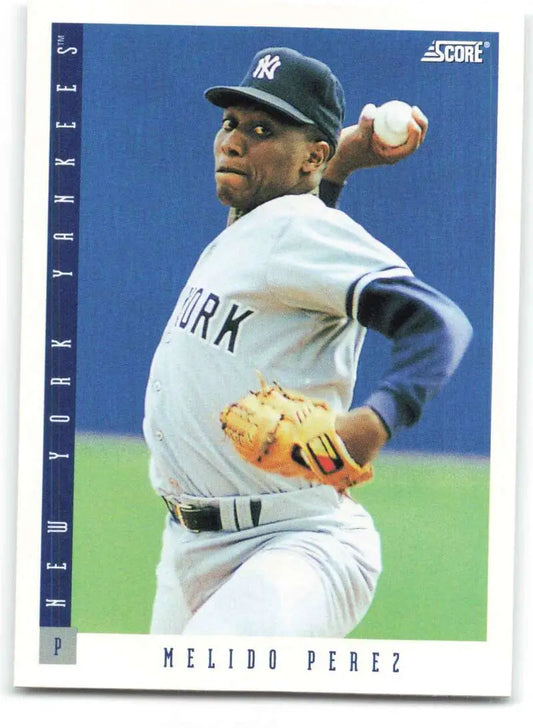 Baseball card of Melido Perez, New York Yankees pitcher in mid-throwing motion