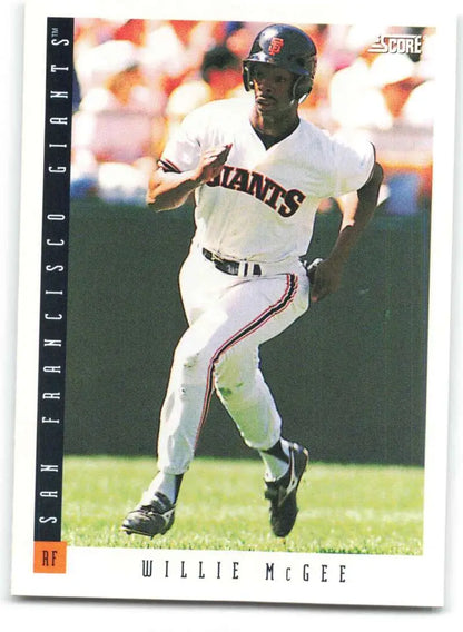 Willie McGee running in a white uniform on a San Francisco Giants baseball card