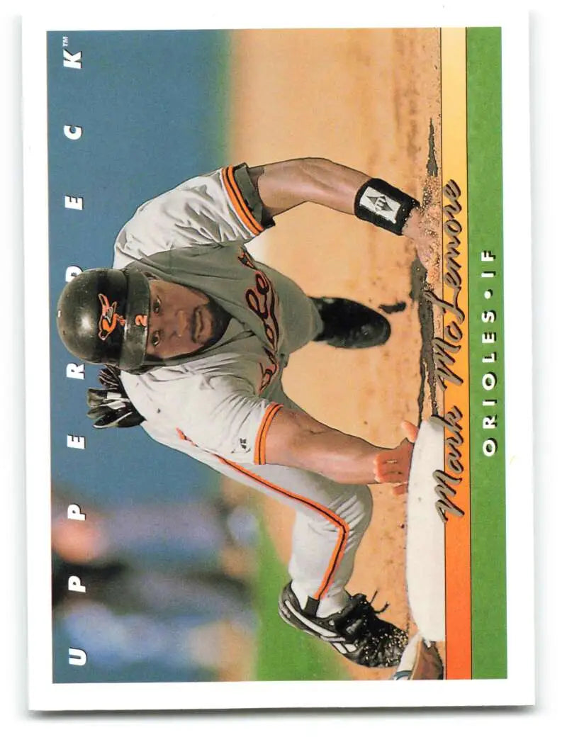 Baseball player in white Baltimore Orioles uniform sliding into base on Upper Deck card