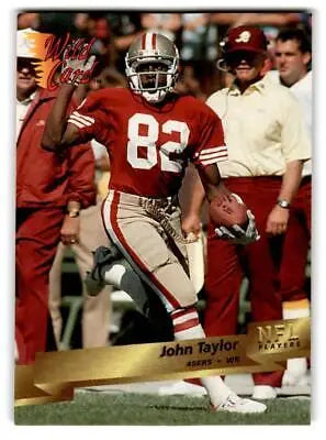 Football player in action on 1993 Wild Card #3 John Taylor trading card