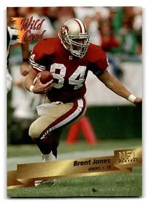 Football player in action on 1993 Wild Card #5 Brent Jones trading card