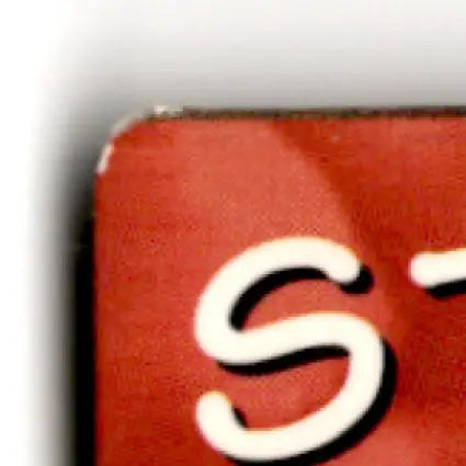 Red curved corner of San Francisco 49ers action packed football collectible with white S dash