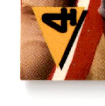 Triangular yellow warning sign with black symbol on 1994 Bowman Football Steve Young card