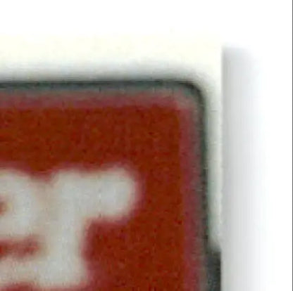 Corner of a red and white playing card from classic baseball Alan Benes St. Petersburg Cardinals