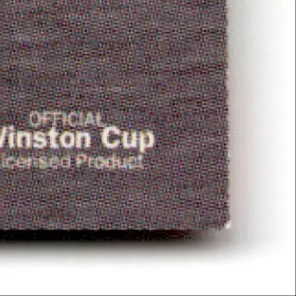 Close-up of dark fabric with OFFICIAL Winston Cup Licensed Product for Power Jack Roush