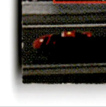 Red and black toy car with yellow lights from 1994 Pro Set Power Racing George Bradshaw #79