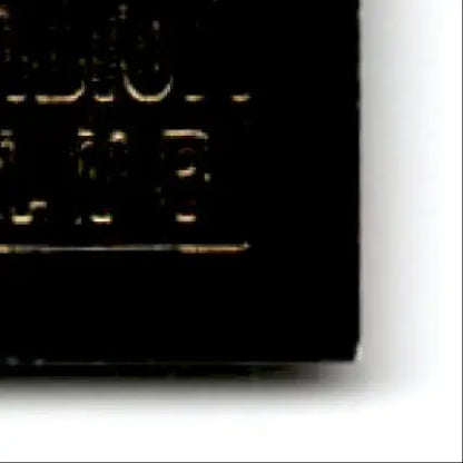 Black electronic component with gold markings for Topps Football Stadium Club Steve Young card