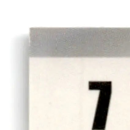 Close-up of a calendar page with number 7 for the 1995 Finish Line Geoff Bodine NASCAR car