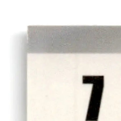 Close-up of a calendar page with number 7 for the 1995 Finish Line Geoff Bodine NASCAR car