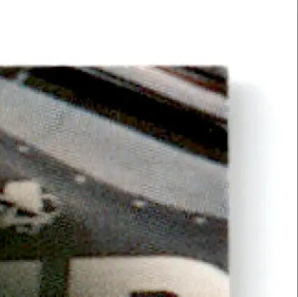 Corner of a book with textured cover and black and white stripes for Finish Line Geoff Bodine #7